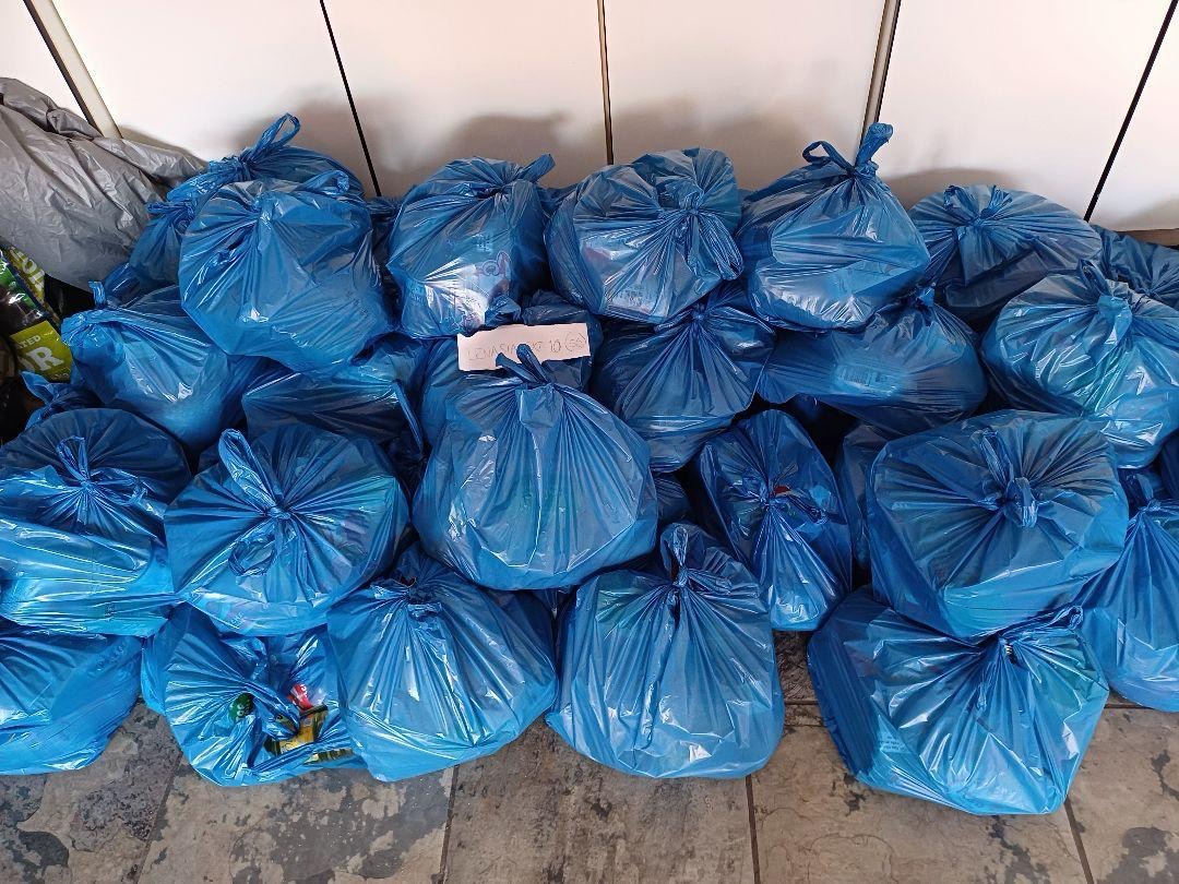 Volunteers preparing food parcels for the community